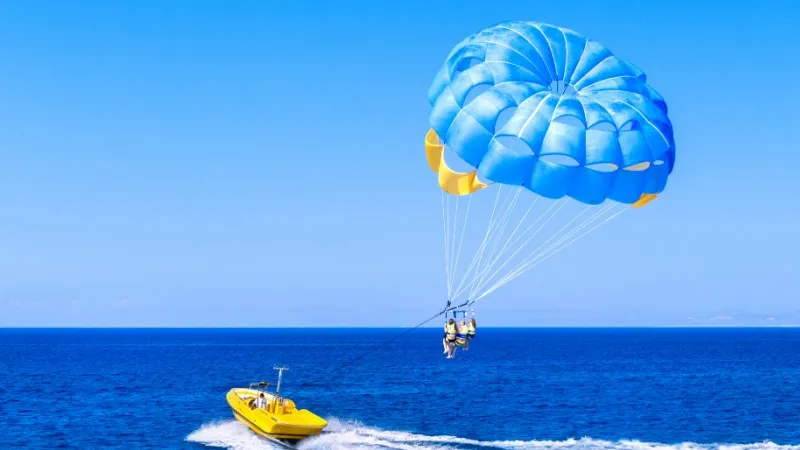 Flying Over the Pristine Blue Waters of the Maldives by Parasailing