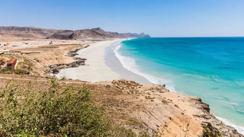 Unwind on Al Mughsail Beach