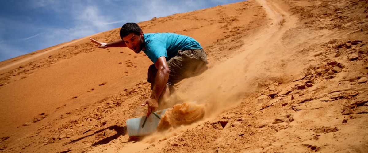 Sandboarding In Qatar: A Feeling Of Adrenaline Rush In The Desert Terrain